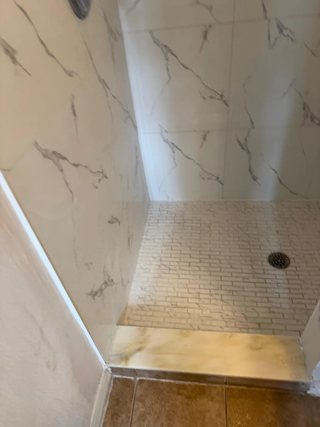 Tile detail work in a shower corner