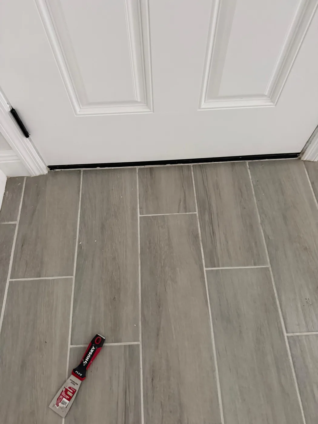 Plank flooring running down a hallway